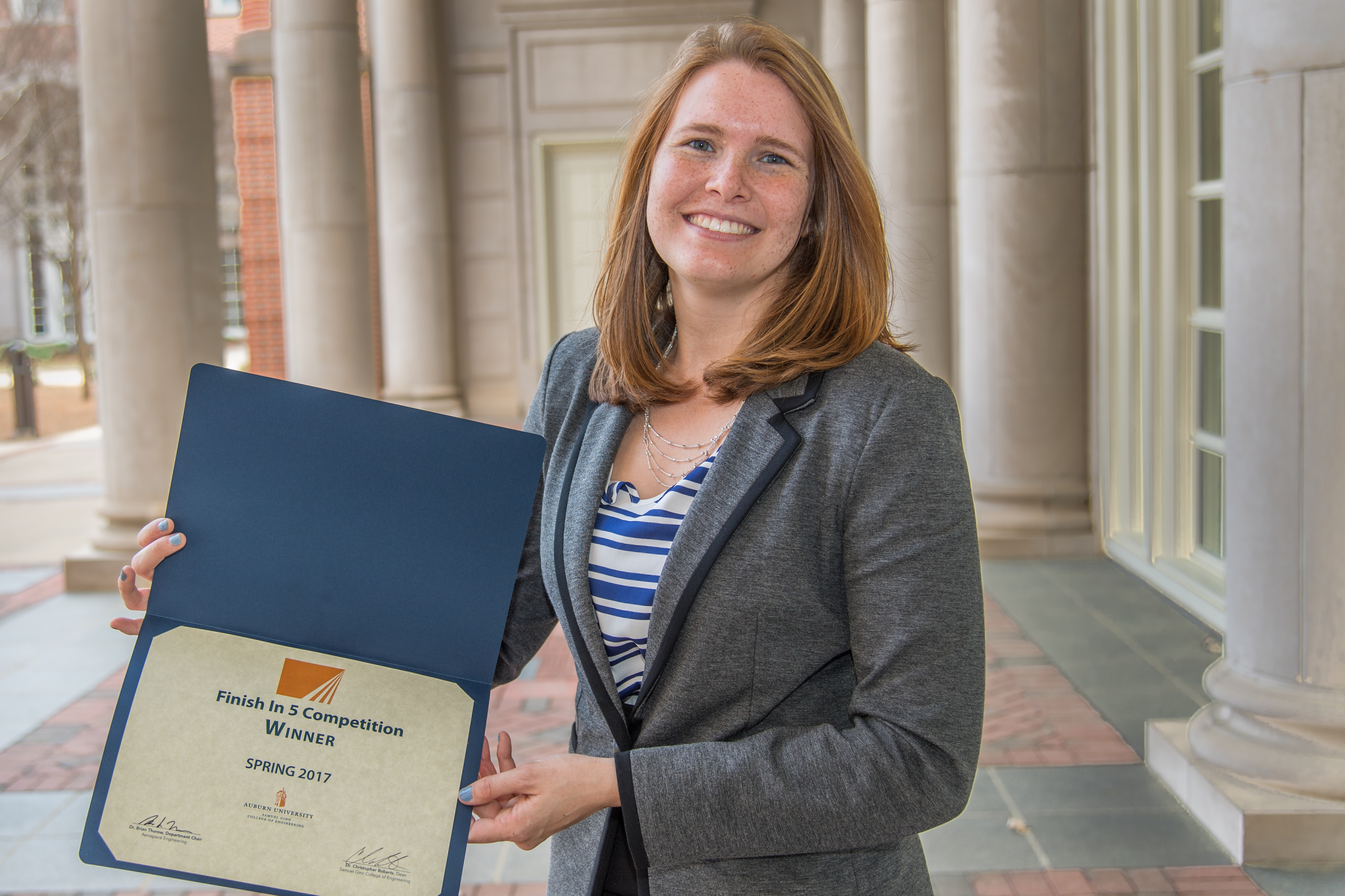 Sarah Gustitus is shown with her award certificate.